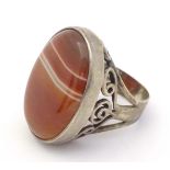 A silver dress ring set with agate cabochon. Hallmarked London 1974 maker GP Please Note - we do not