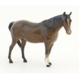 A Beswick model of a brown horse. Model no. 701. Marked under Approx. 4 3/4" high Please Note - we