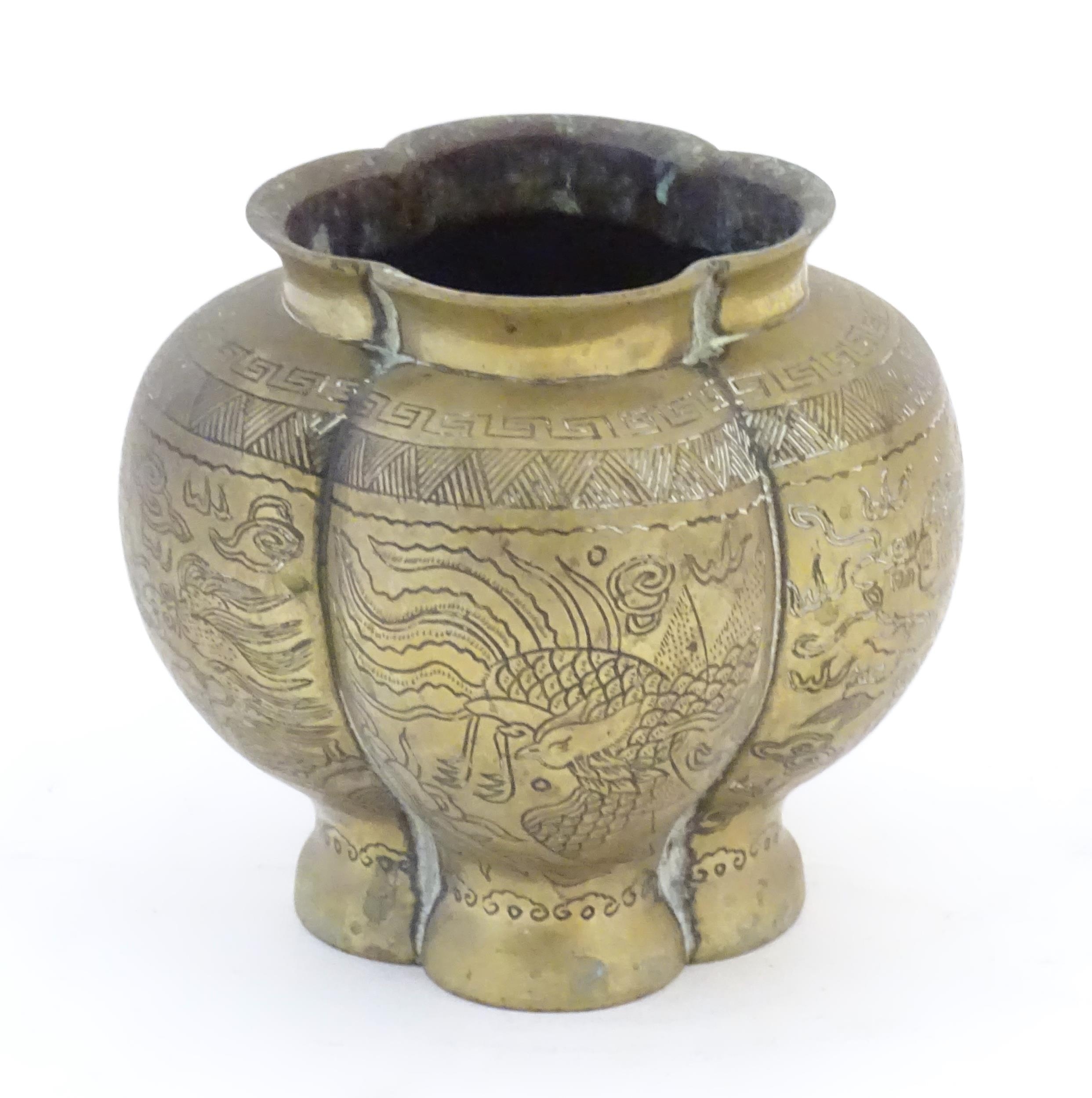 A Chinese brass lobed pot decorated with dragons, phoenix birds and pagoda buildings. Character - Image 3 of 7