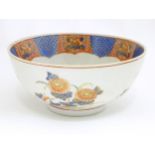 An Oriental bowl decorated with flowers and foliate in the Imari palette. Marked under. Approx. 4