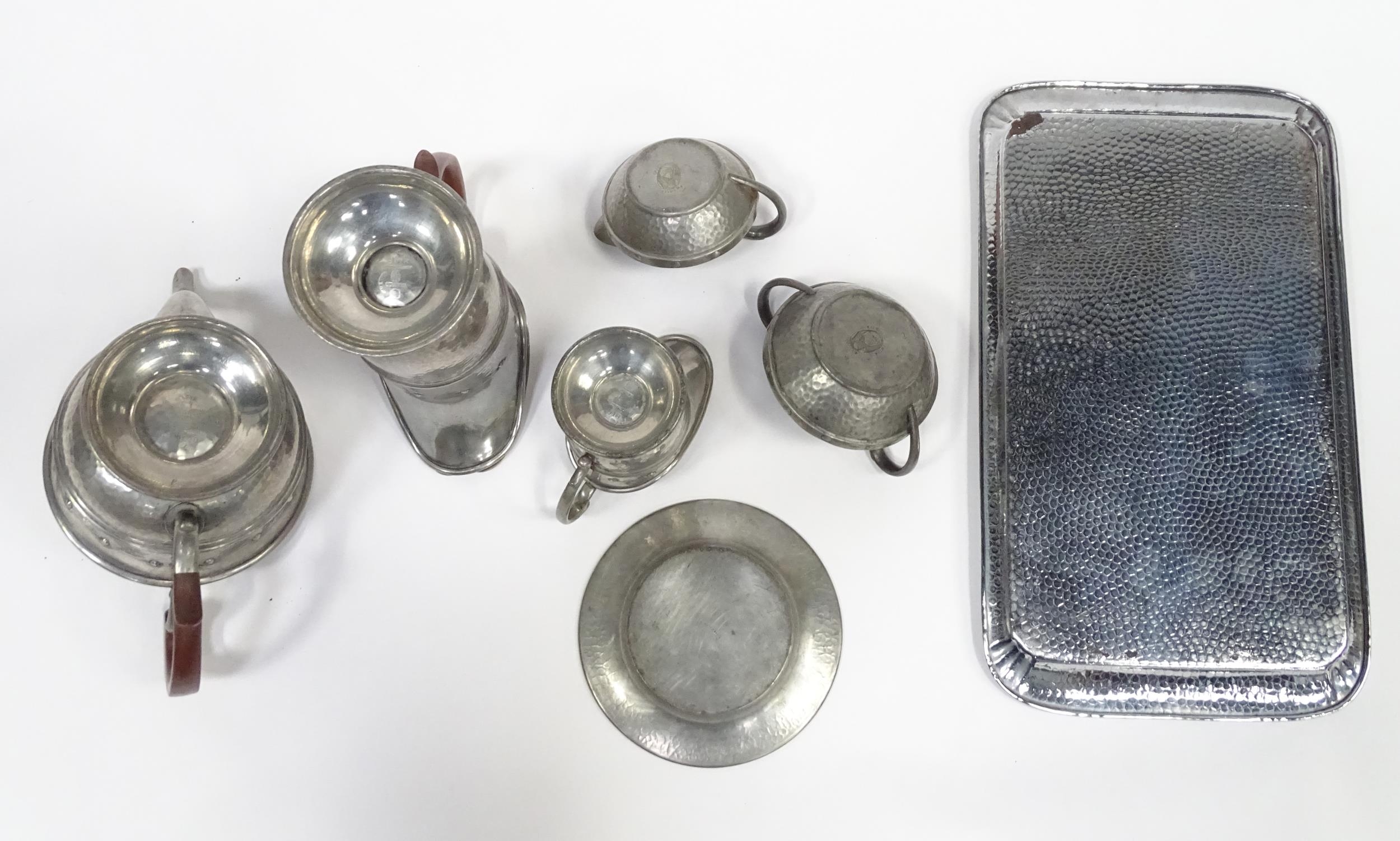 A quantity of Arts & Crafts style pewter tea wares with hammered decoration comprising teapot, - Image 15 of 18