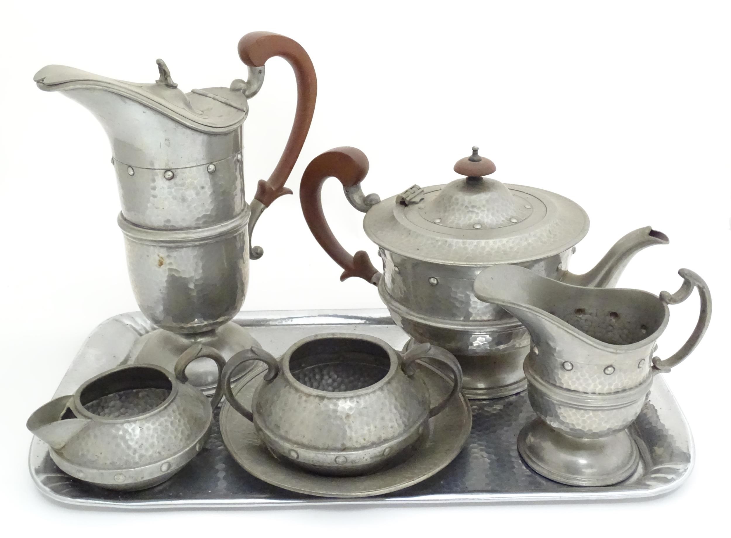 A quantity of Arts & Crafts style pewter tea wares with hammered decoration comprising teapot, - Image 18 of 18