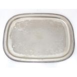 A large silver plate tray with engraved decoration. Approx. 22 1/2" wide Please Note - we do not