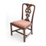 An early 20thC mahogany Chippendale style side chair with shaped and carved cresting rail above a