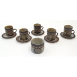 Five Briglin studio pottery coffee cups and saucers, together with a sugar bowl. Cups approx. 3"