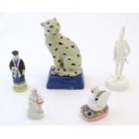 Five assorted ceramic items to include a 20thC French candle snuffer modelled as a figure by