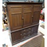 A large aesthetic period cupboard, the top with moulded cornice above 3 doors having shelves within.