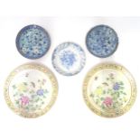 Five assorted Oriental plates to include three various blue and white examples with floral and