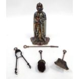 A mid 20thC wrought iron fireside companion set, the stand formed as a knight in armour. Approx