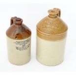 An early 20thC stoneware flagon by Doulton Lambeth, stamped W.G. Deas - Family Grocer - Wine