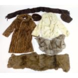 A quantity of assorted vintage furs to include coat, jacket, stoles, etc. The Coat bearing a label