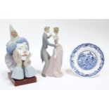 Three ceramic items comprising a Lladro figure group Anniversary Waltz, no. 1372, a Lladro model