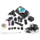 A quantity of cameras and camera accessories to include a Minolta Dynax 7, a Fujifilm FinePix, an