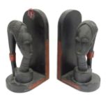 A pair of African carved hardwood bookends with figural head detail. Please Note - we do not make