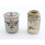 A small Japanese vase decorated with fruiting vine decoration. Character marked under. Approx. 3 1/
