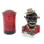 A novelty money box modelled as a post box. Together with another. Post box approx. 6 1/4" high (