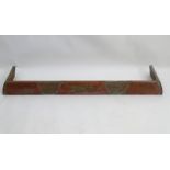 An early 20thC kerb fender, of copper construction with sectional decoration, approximately 50" wide