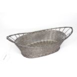A white metal wirework basket. Approx 12" wide Please Note - we do not make reference to the