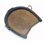 A Victorian oak tray of horseshoe form with twin brass stirrup style handles. Approx. 16" x 17"