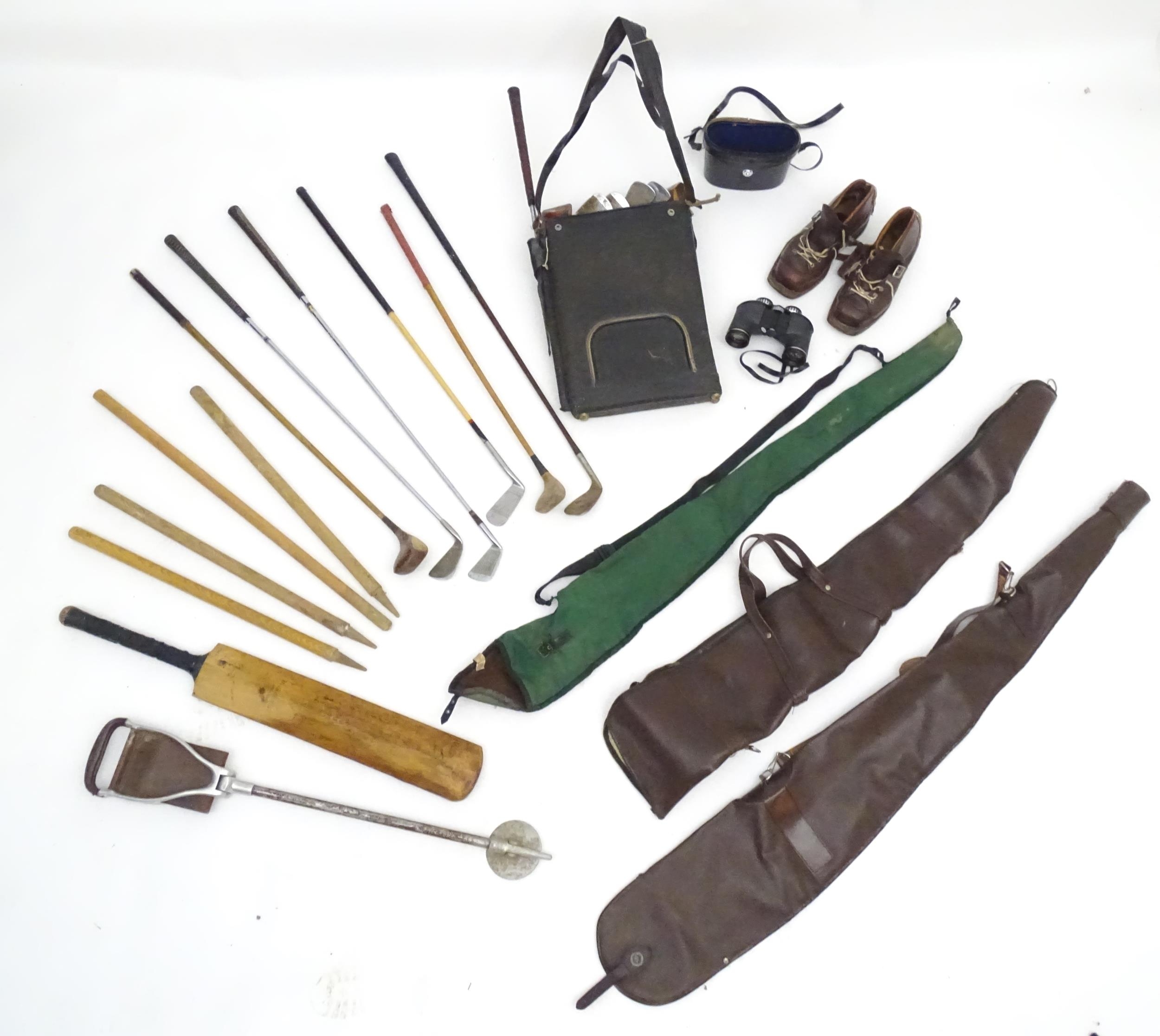 An assortment of mid to late 20thC sporting items, including gun slips, cartridge bag, 12 bore