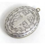 A white metal pendant locket Please Note - we do not make reference to the condition of lots