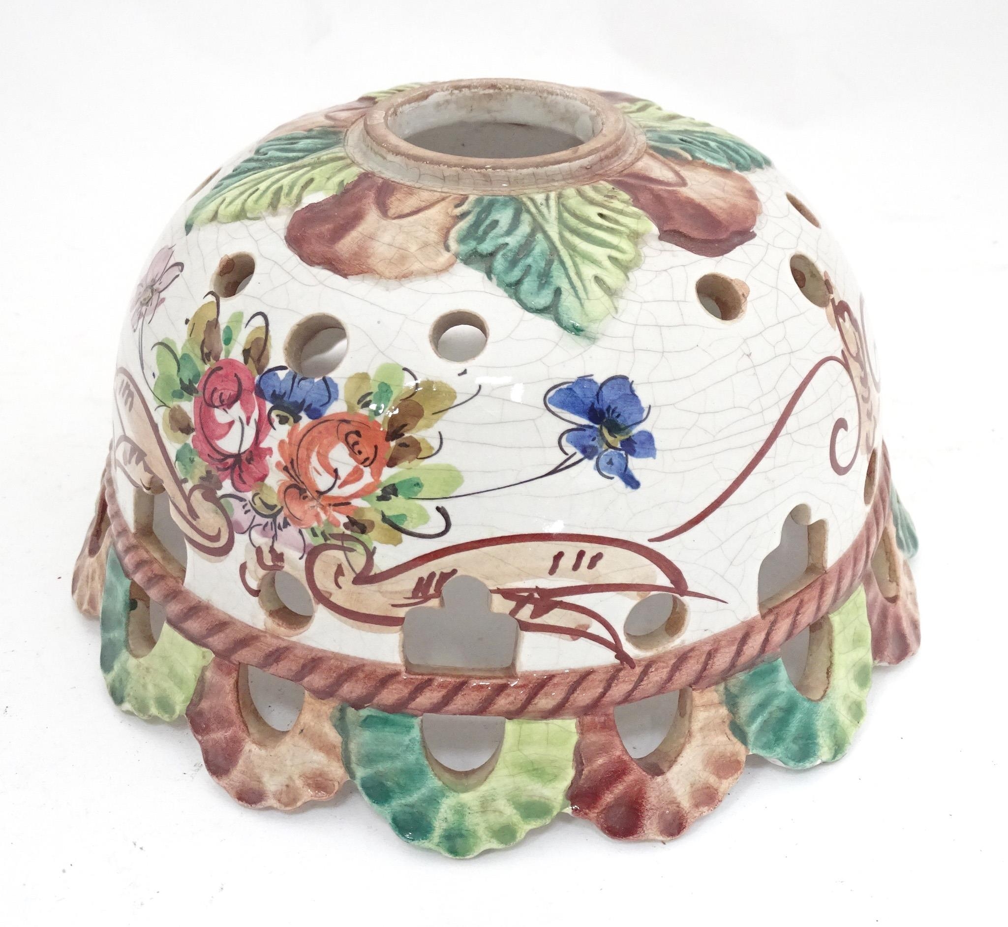 A Continental ceramic lamp shade with floral and foliate decoration. Approx. 8" diameter Please Note