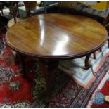A mahogany oval dining table with cabriole legs and pad feet. Approx 45 3/4" long x 41" wide x 28