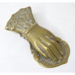 A novelty brass letter clip / paper clip formed as a hand. 5 1/4"long Please Note - we do not make