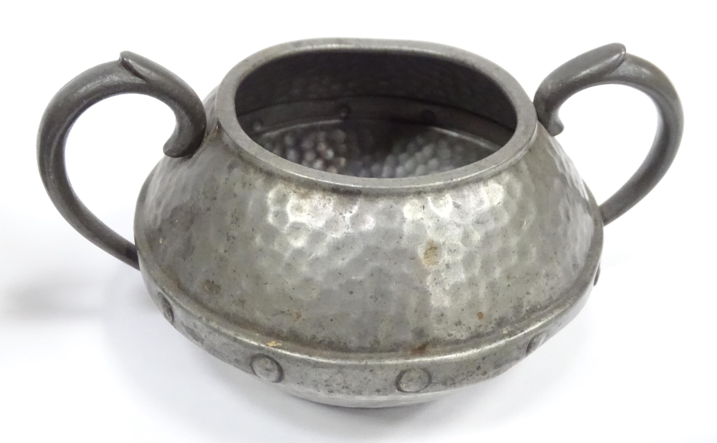 A quantity of Arts & Crafts style pewter tea wares with hammered decoration comprising teapot, - Image 11 of 18