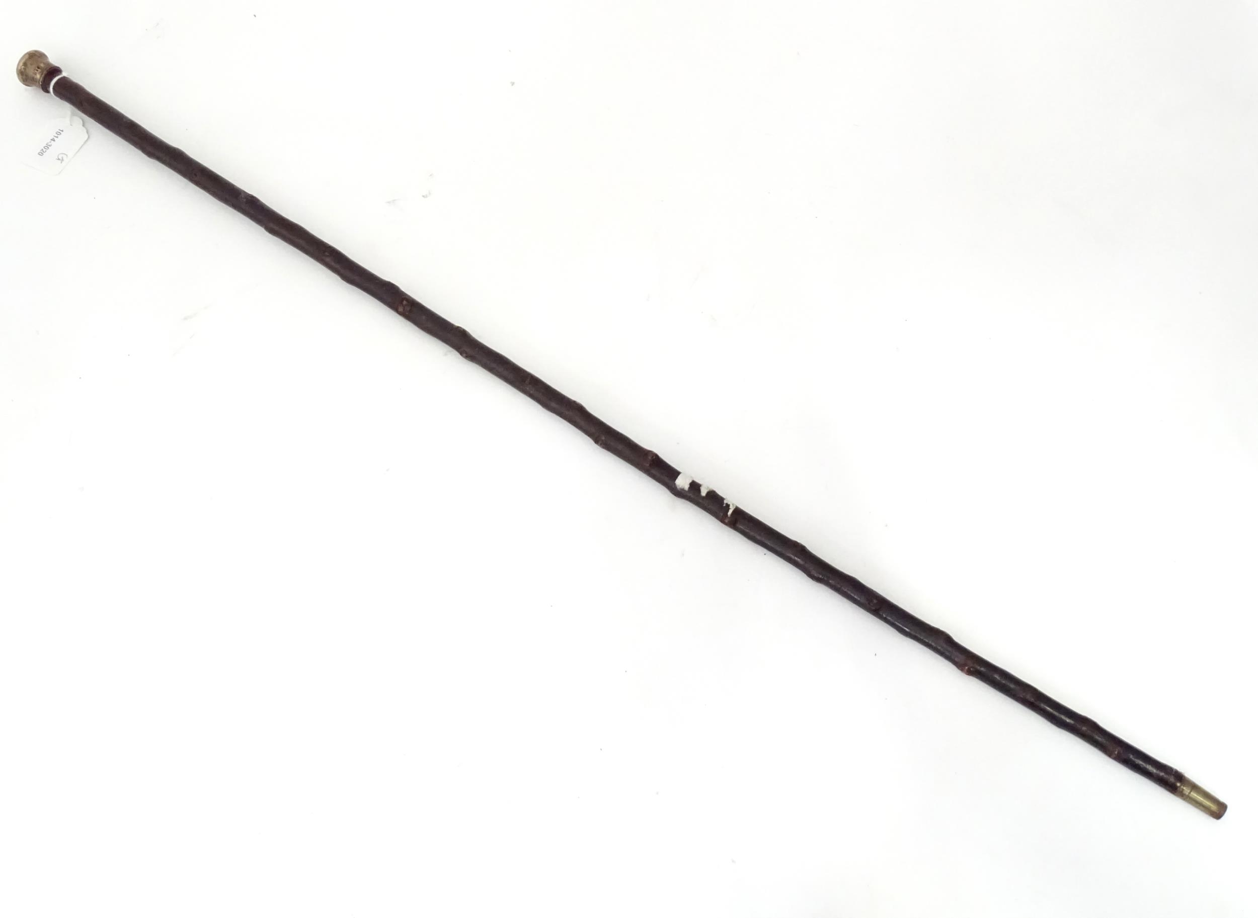 Walking stick / cane : A wooden stick with silver top hallmarked London 1900. 34 1/2" long Please