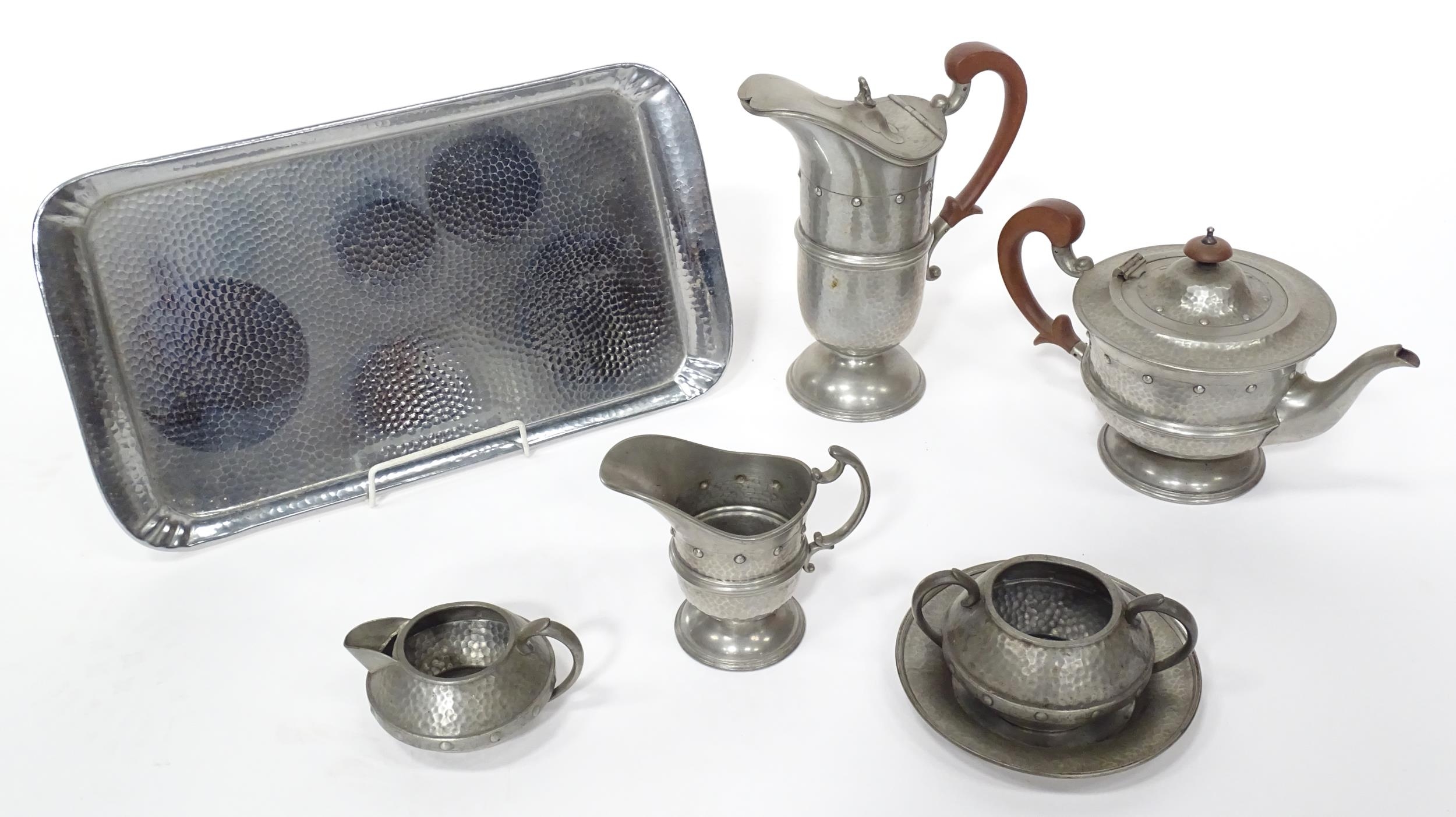 A quantity of Arts & Crafts style pewter tea wares with hammered decoration comprising teapot, - Image 6 of 18