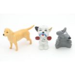 A Beswick model of a yellow labrador, together with a novelty salt and pepper modelled as cartoon