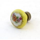 A Victorian porcelain handle / cane top with hand painted floral detail. Approx. 1 1/4" diameter