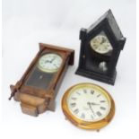 Three assorted clocks to include two wall clocks and a mantle clock. The mantle clock approx. 20"