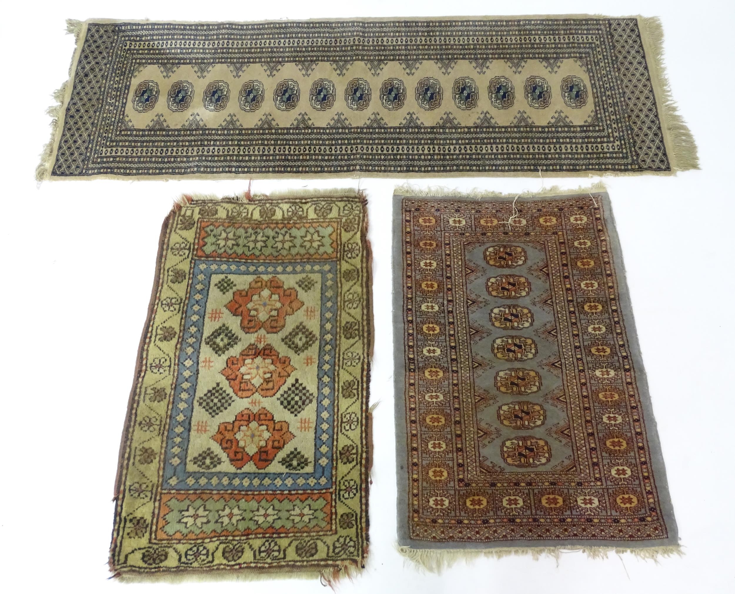Three rugs to include a runner approx 73" long a prayer mat approx 37" long and another approx 37"