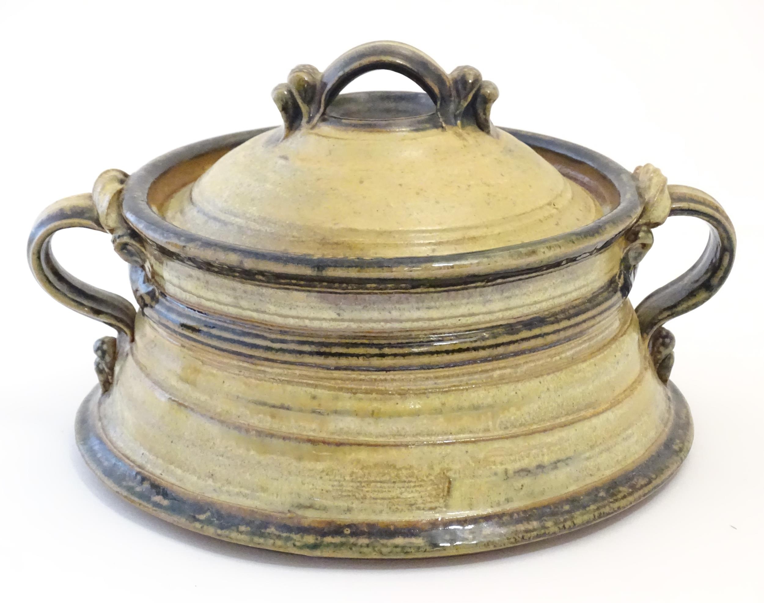 A studio pottery stoneware twin handled pot and cover / waisted tureen. Approx. 5 1/2" high x 9 3/4"