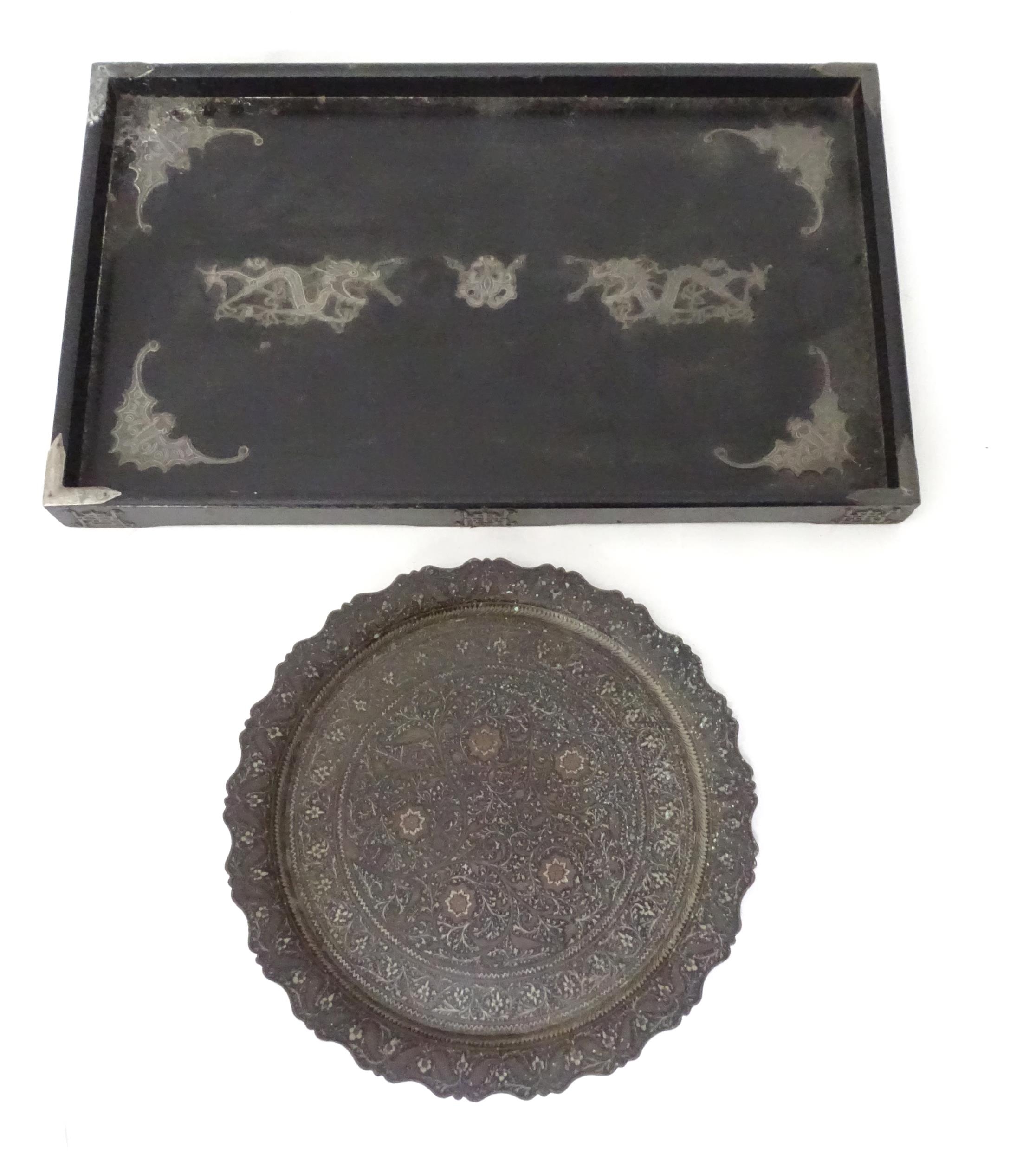 An oriental ebonised tray with white metal bat and dragon detail, 20 x 12" approx. Together with a
