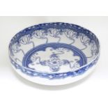 A large blue and white Doulton Burslem bowl in the Kelmscot pattern with Art Nouveau detail.