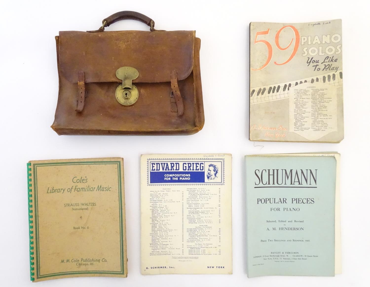 A late 19th / early 20thC leather attache case containing sheet music to include Edward Grieg -