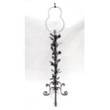 A wrought iron floor standing lamp stand with floral detail. Approx 67" high overall Please Note -