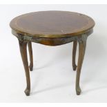 A late 20thC inlaid occasional table. Approx. 21 1/2" high Please Note - we do not make reference to