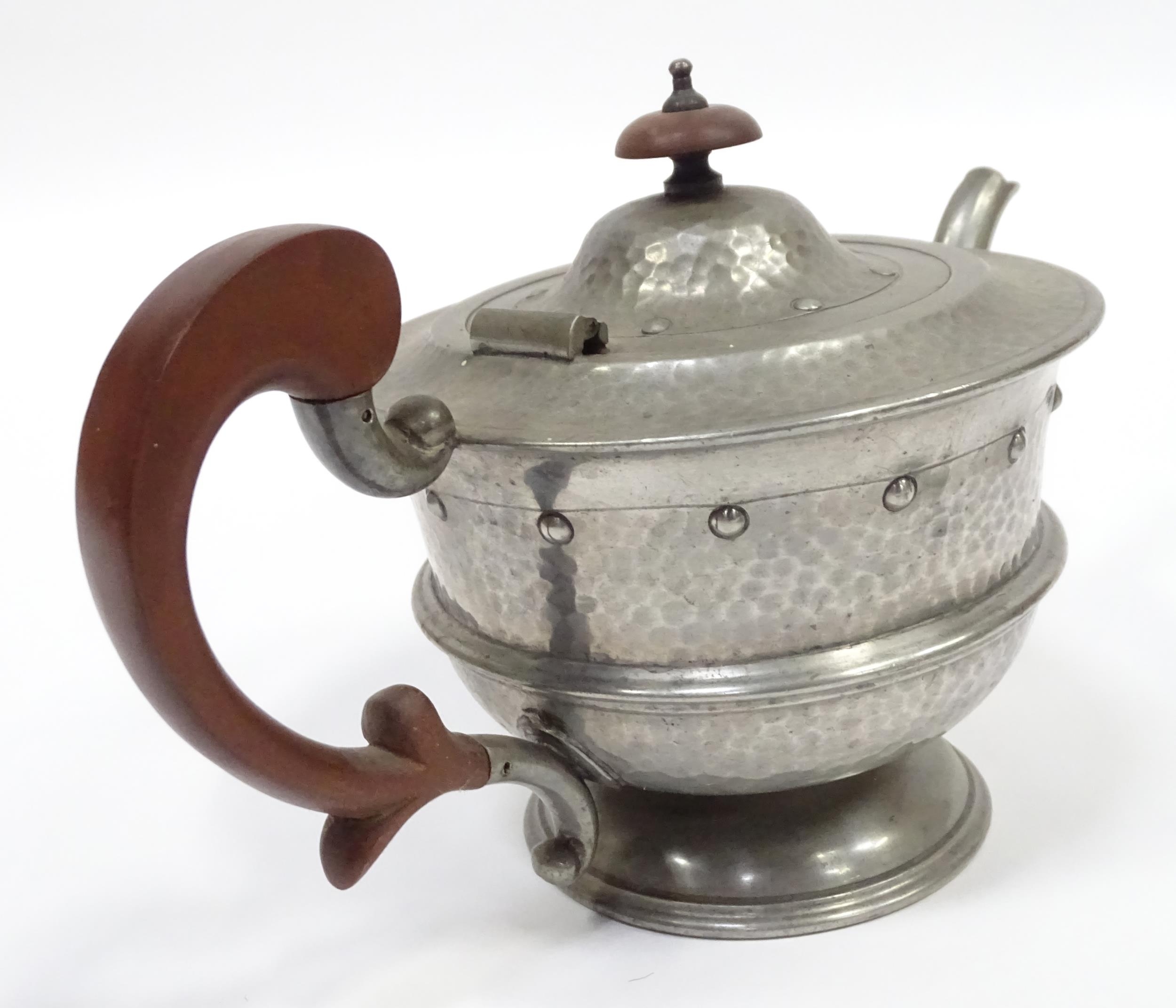 A quantity of Arts & Crafts style pewter tea wares with hammered decoration comprising teapot, - Image 13 of 18