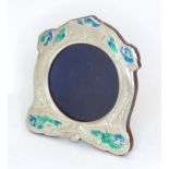 A white metal photo frame with enamel decoration in the Art Nouveau style, approx. 6" high Please