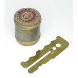 A brass canister together with a military button polishing plate with War Department stamp. The