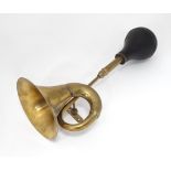 A novelty brass automobile / car horn, approx 18" long Please Note - we do not make reference to the