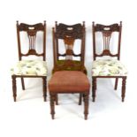 A set of four early 20thC Aesthetic style walnut dining chairs for re-upholstery. 20" wide x 19"
