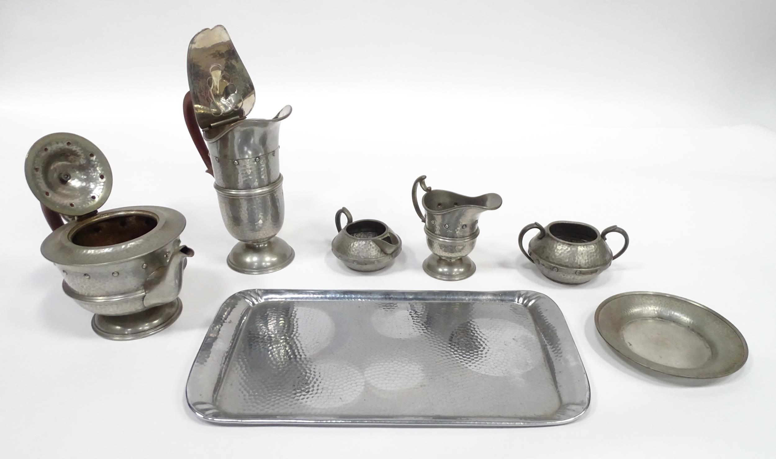 A quantity of Arts & Crafts style pewter tea wares with hammered decoration comprising teapot, - Image 7 of 18