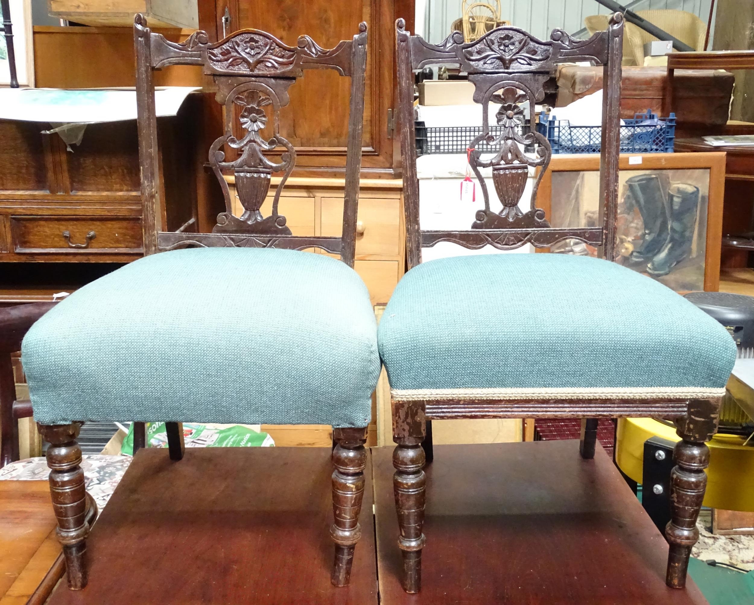 A pair of 19thC low chairs with carved splats. Approx. 31" high (2) Please Note - we do not make