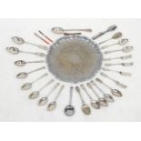 Assorted silver plated wares to include a salver, stuffing spoon, basting spoons, berry spoon, table