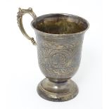 A Victorian silver christening mug with engraved decoration, hallmarked Birmingham 1862, maker Henry